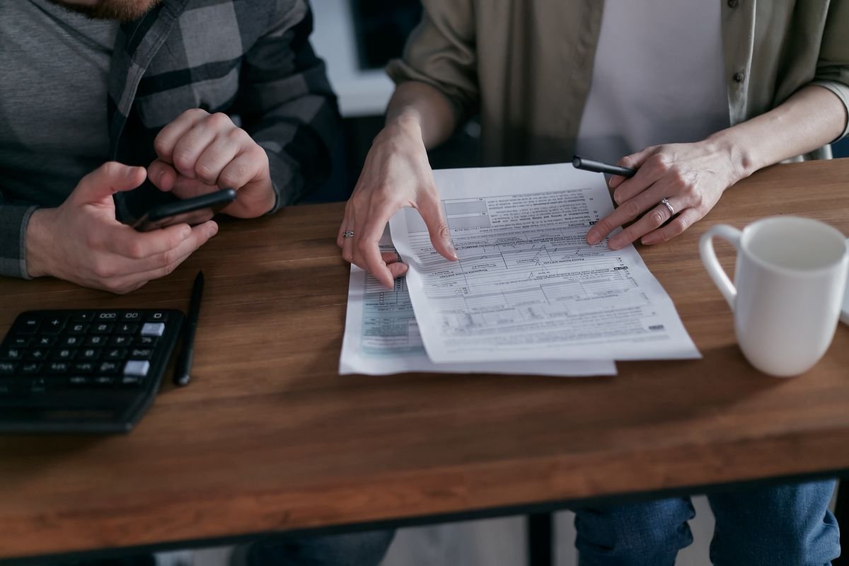 Reviewing financial paperwork together at a desk
